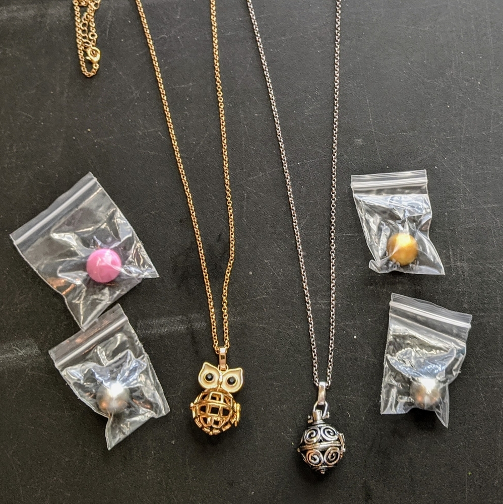 2 locket necklaces and 4 chimer balls